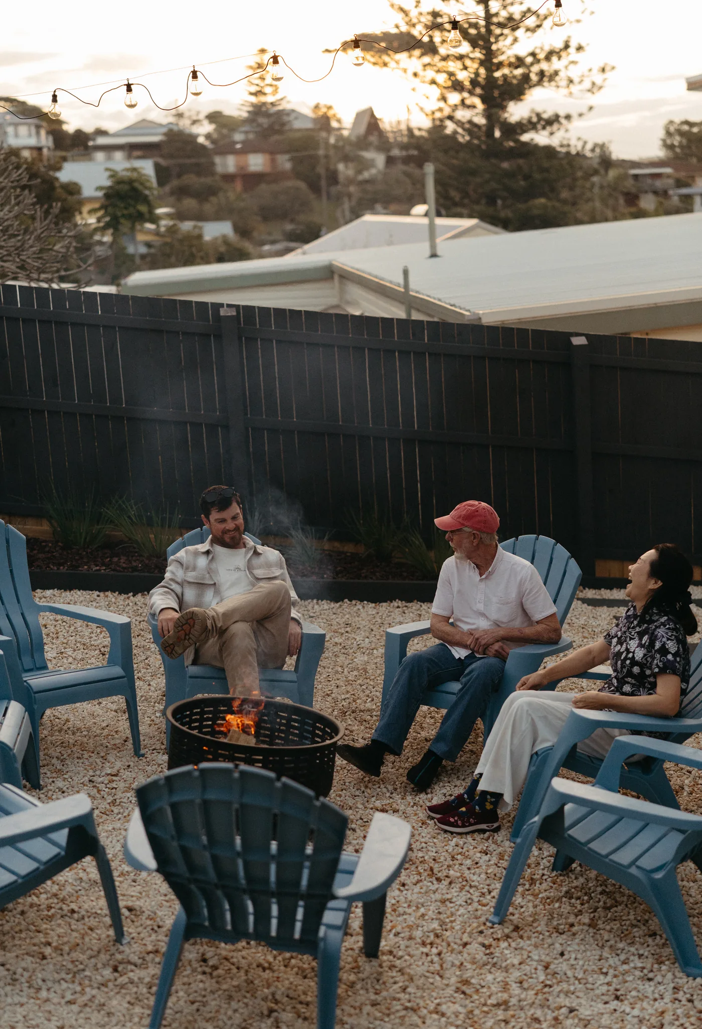 Friends around the backyard fire pit